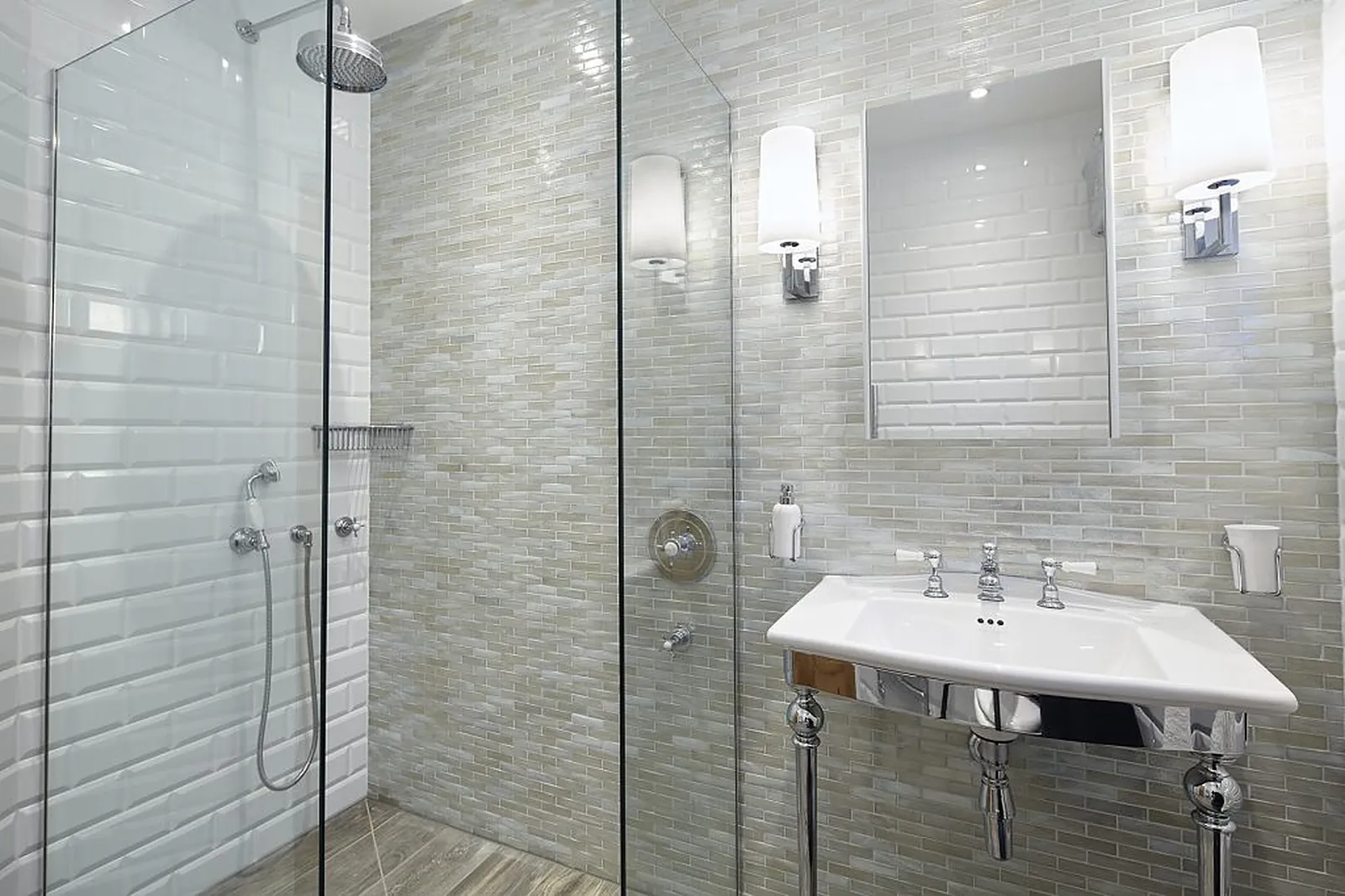 White metro tiles, marble and a glass shower enclosure