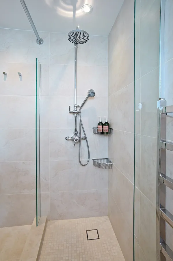 Step-over wet room with a curtain to save space
